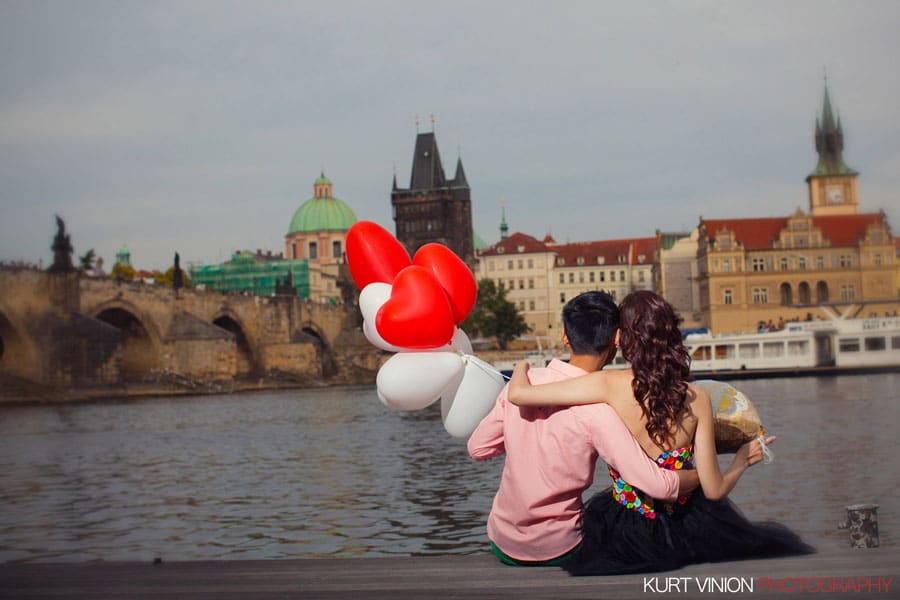 good looking couple, embracing, red & white balloons, Prague Castle, daytime